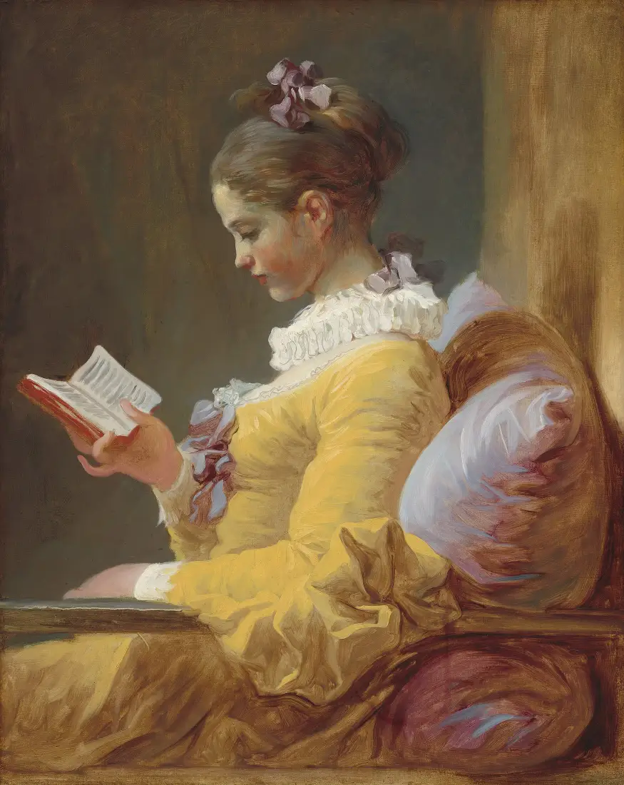 A reader absorbed in a small book
